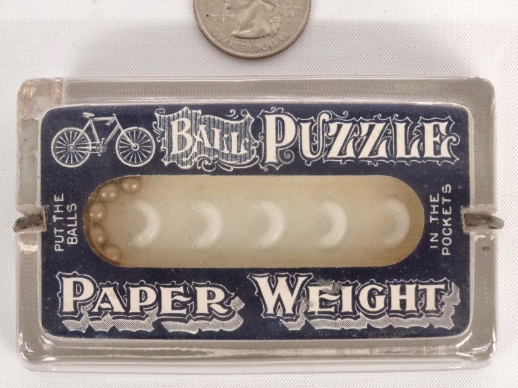 19th c. Rare Paperweight: 19th c. Ball puzzle paper weight with early safety logo, clear glass, paper litho and milk glass, signed "Mfgd by E.C. Gipe Freeport Ill". 2 1/4" x 3 3/4". Large chip on base.