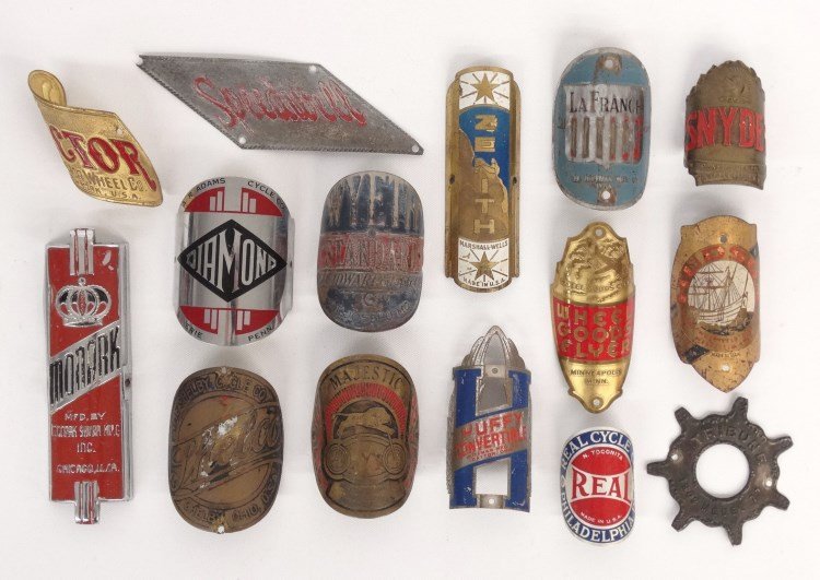 Bicycle Head Badge Collection: Bicycle head badge collection including: Victor, Diamond, Hudson, Monark, La-France, Wheel Goods Flyer, Huffy, Wyeth, Zenith, Speedwell, Tribune, Snyder, Majestic, Real, Shelco. Fair to good condition