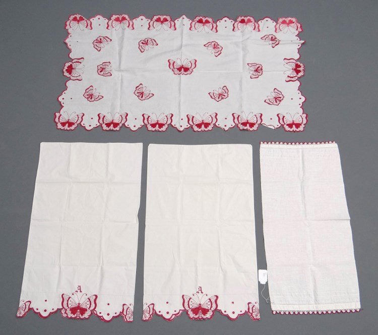 Vintage Linens: Lot of redwork vintage linens including towel (17"x 35"), table runner (55" x 31 1/2") and (2) pillowcases (36" x 22"). Deaccessioned from the American Folk Art Museum New York.