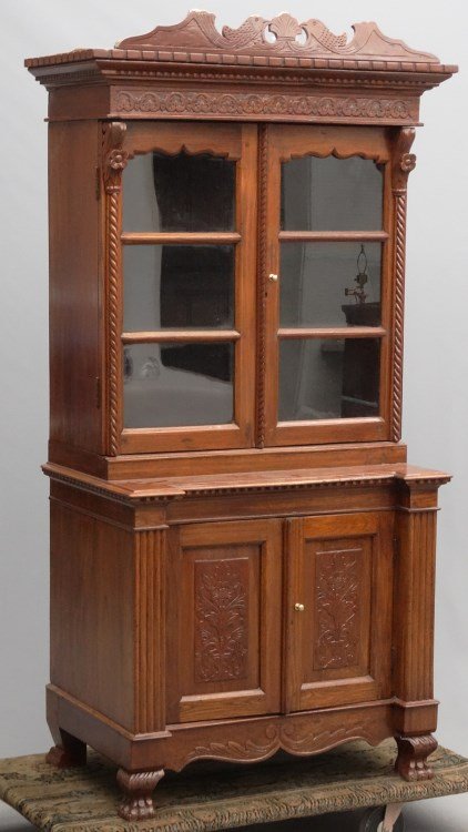Mahogany Secretary: Mahogany secretary. Top has carved cornice over two glass doors, base with two doors with carved panels. 33" x 22" x 71" Ht.