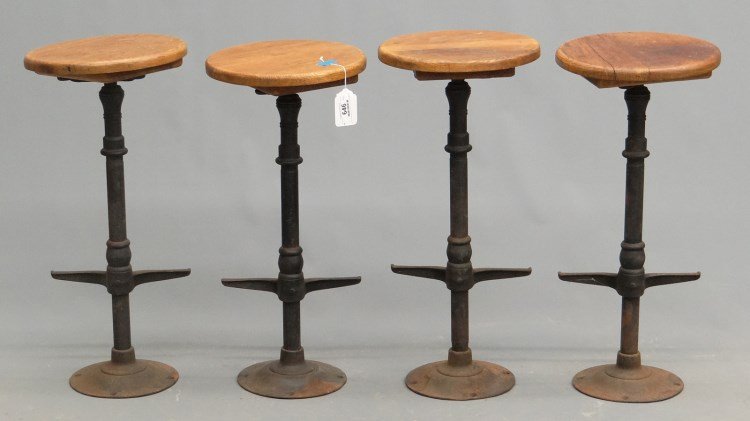 C. 1900's Iron & Wood Revolving Stools: Four C. 1900's iron and wood revolving stools. 25 1/2" Ht., 12" seat.