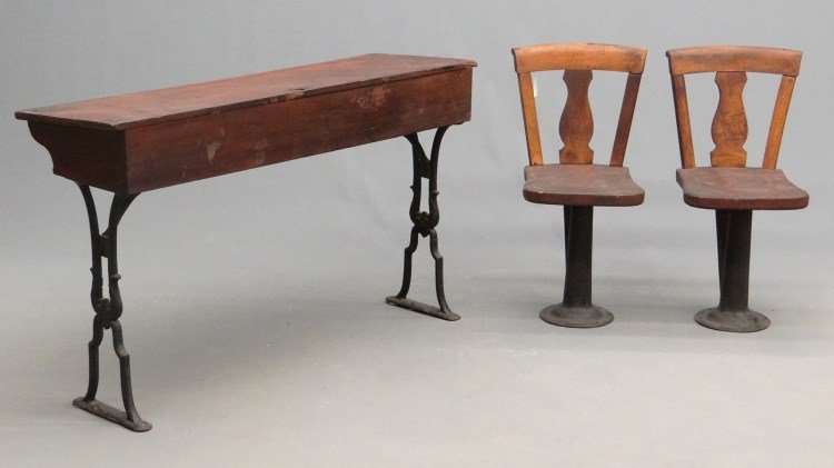 C. 1900's School Desk & Chairs: C. 1900's school desk with cast iron base. 48" x 16" x 29" Ht., along with (2) chairs (29 1/2" Ht.).