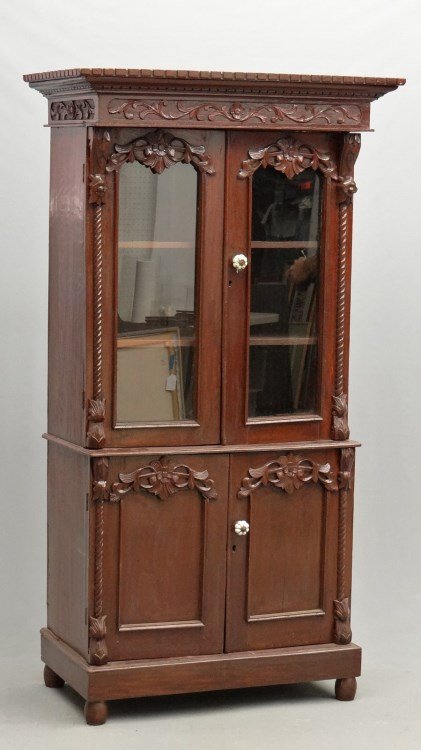 Mahogany Secretary: Mahogany secretary having (2) glass doors over (2) paneled doors. Carved cornice. 38" x 22" x 71" Ht.