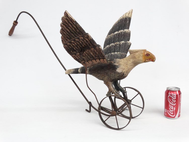 Folk Art Floor Toy: 20th c. folk art painted wooden flapping wing bird floor toy. 19" wing span, 34" deep, 17" Ht._x000D_