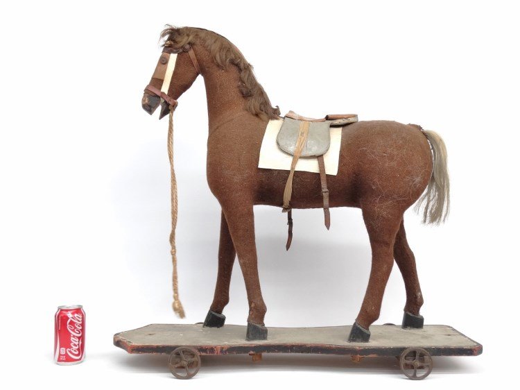 19th c. Platform Horse: 19th c. burlap covered wooden child's platform horse on wheels. 30" x 9"x 30 1/2" Ht._x000D_ _x000D_