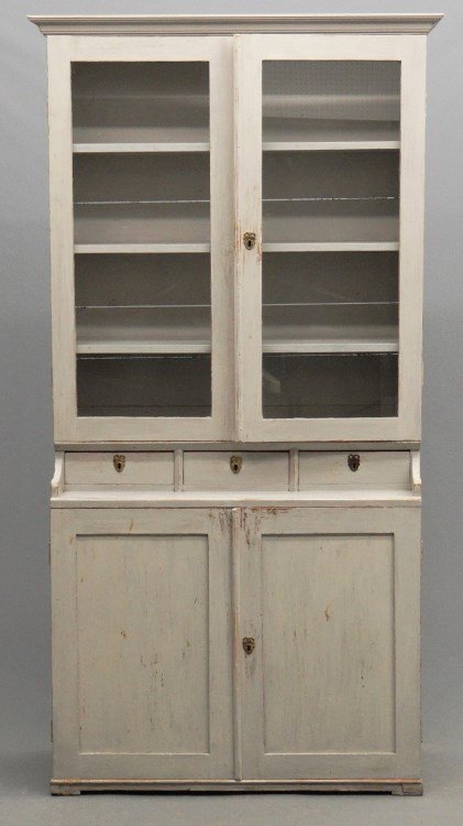 Swedish Cupboard: Early Swedish wall cupboard having (2) glass doors over (3) drawers over (2) doors. 43" x 16 1/2" x 82" Ht. Provenance Cupboards And Roses Sheffield Mass.