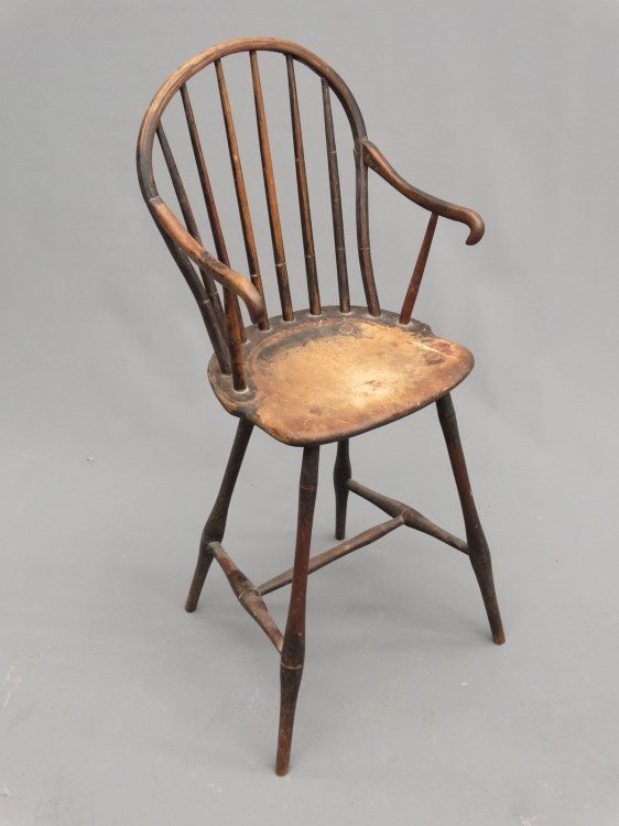 Windsor Highchair: Early Windsor child's highchair in old black paint. 35" Ht., some damage to arm.