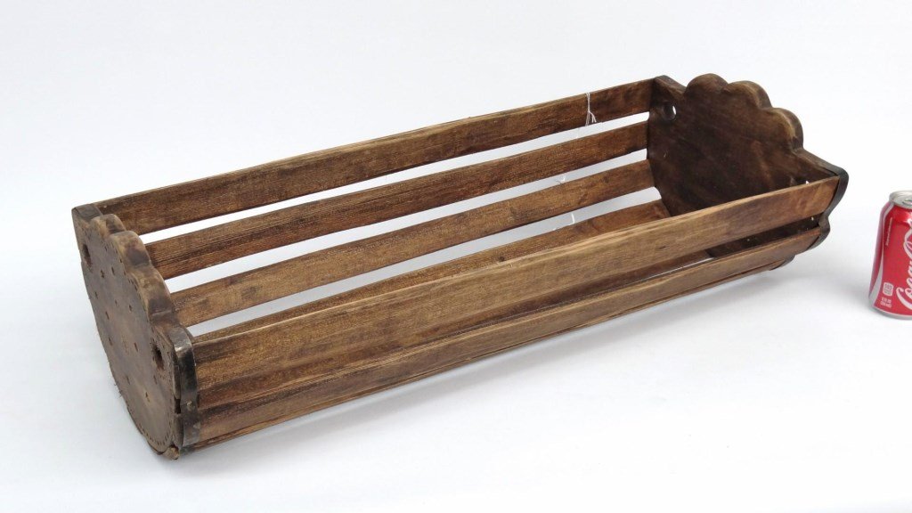 Hanging Cradle: Primitive hanging cradle with Cross motif. 27 1/2" x 11" x 8" Ht.