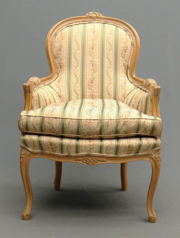 French Provincial Bergere Chair: French Provincial upholstered Bergere chair with carved frame. 21" seat Ht., 38 1/2" overall Ht.