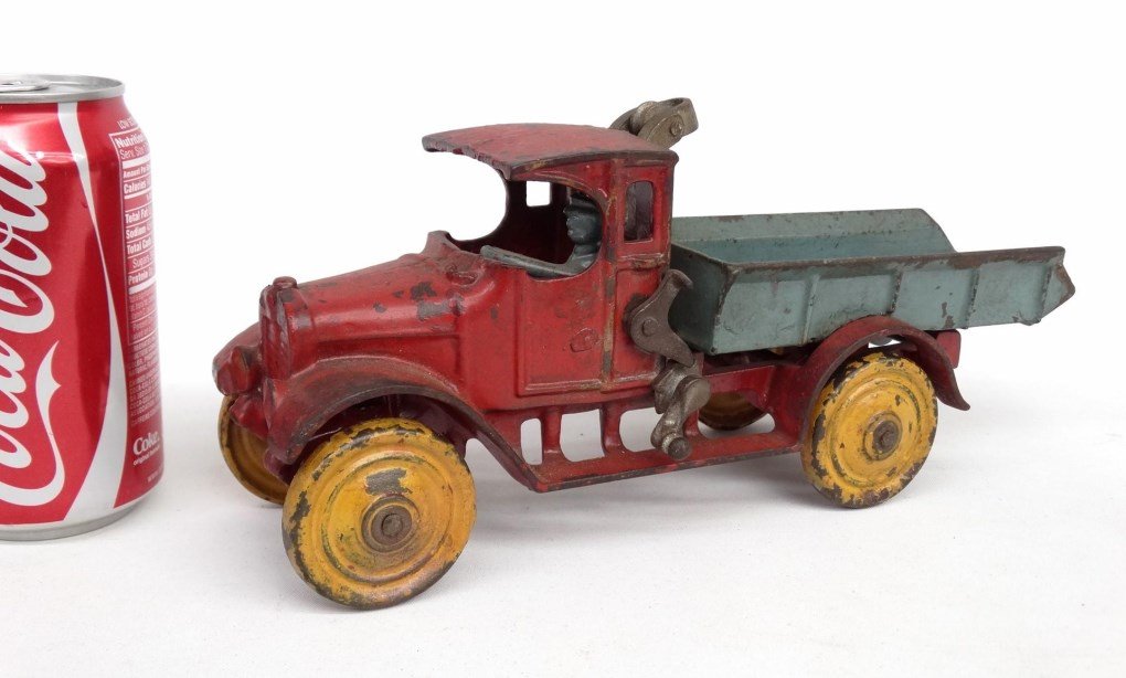 Cast Iron Tow Truck Toy: Cast iron tow truck toy with driver. 11" L.