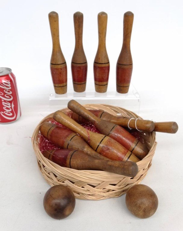 Set of (10) Pins And Balls: Set of (10) wooden pins (6 1/2" Ht.), along with (2) balls.
