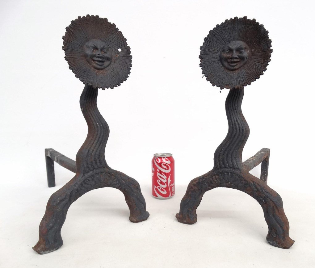 Pair Sun Face Andirons: Pair cast iron sun face andirons, attributed to Bradley & Hubbard. One slightly damaged. 16 1/2" Ht., 16" D..