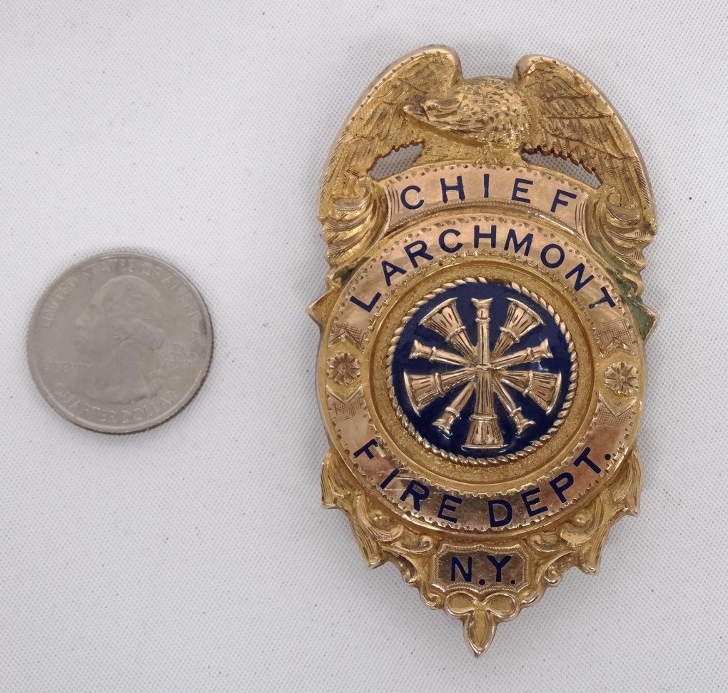 14 Karat Gold Firemans Badge: Marked 14 Karat gold Firemans badge, "Chief Larchmont Fire Dept. N.Y.. Engraved on backside "Duncan MacPhail , May 9, 1959, Engine Co. No. 1". 3" L..