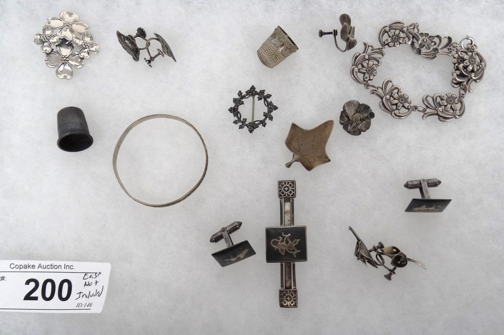 Sterling Silver Lot: Misc. sterling silver lot including thimbles, bracelet, cufflinks, earrings etc.. Case not included.