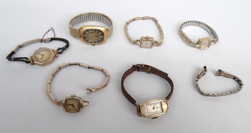 Watch Lot: Lot (6) various watches including Gruen with 10 Karat gold bezel, Hamilton, etc., along with a band.