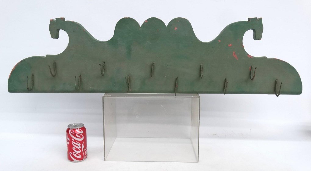 Hook Rack: Wood and iron hook rack with stylized horse heads. 39" W., 10" Ht..