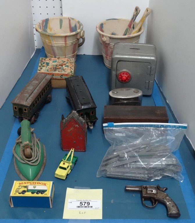 Toy Lot: Misc. toy lot including early pails, banks, trains, toy gun, boxed Santa Claus Cycle toy, iron, Matchbox in orig. box, etc..