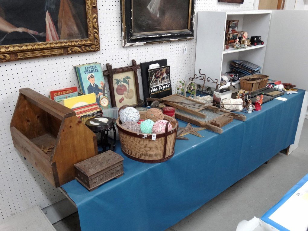 Misc. Lot: Misc. table lot including toy trains, mirrored sconce, gemstones, vintage children's books, cast iron stars etc..