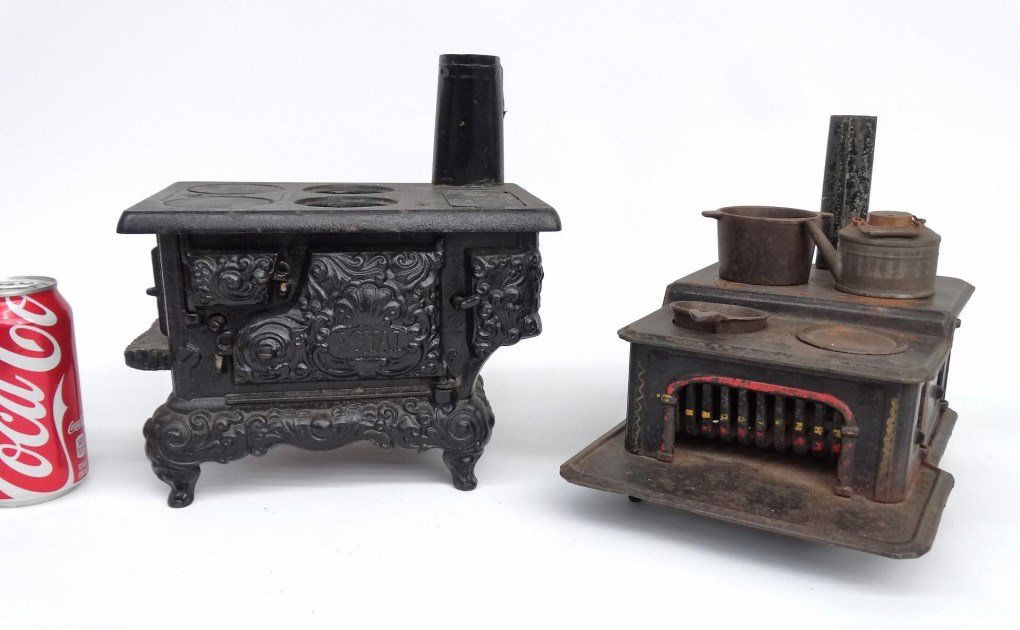Cast Iron Toy Stoves: Lot (2) cast iron toy stoves. 7 1/2" x 9 3/4" x 9" Ht. and 6 1/2" x 9" x 10 1/2" Ht..