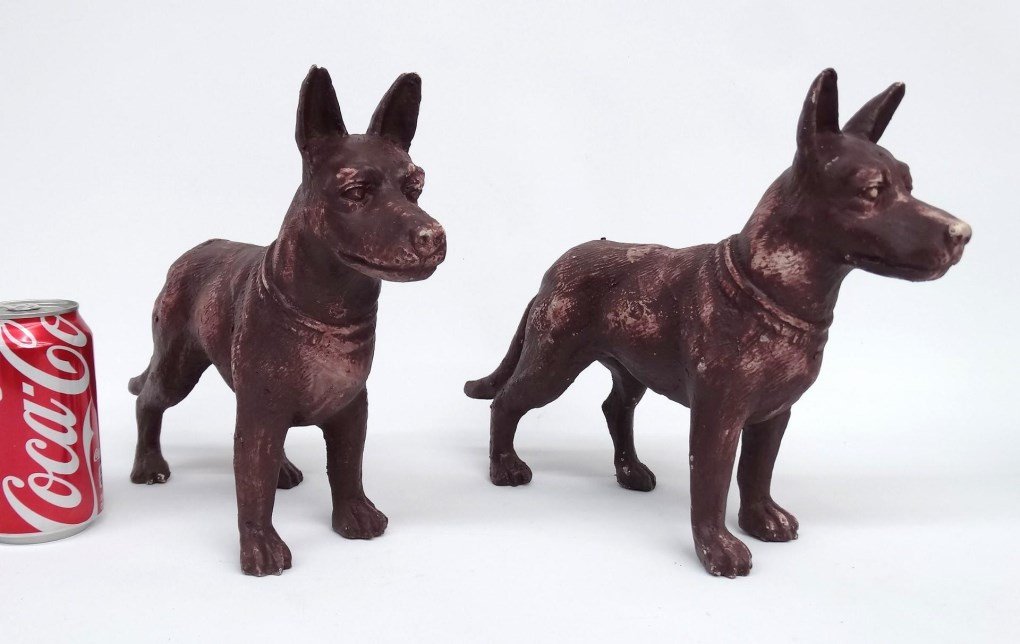 Pair Cast Iron Dogs: Pair of cast iron dogs. 13" L., 9" Ht..
