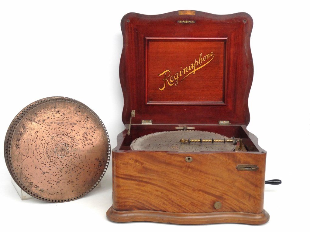 Reginaphone: 19th c. Reginaphone with (11) discs. Working condition. Case 21" 1/2 x 18 1/2" x 12" Ht..
