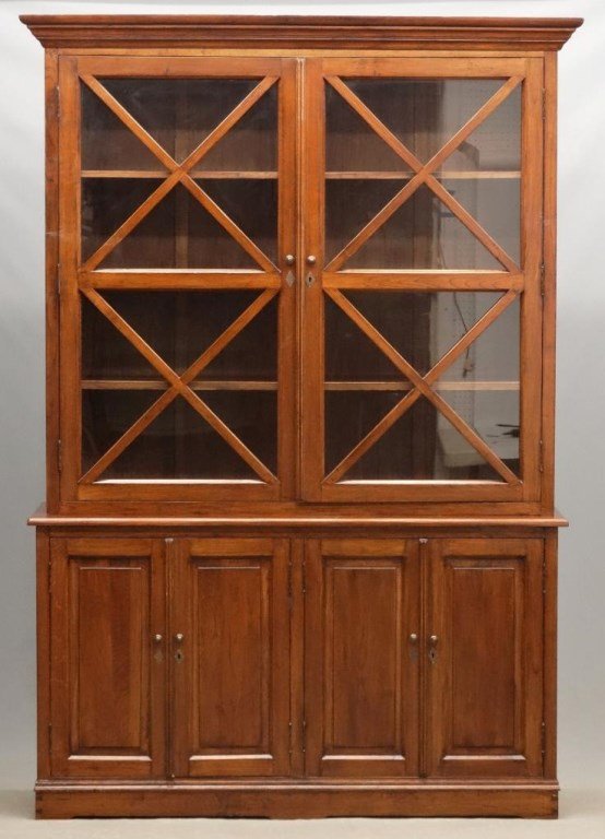 Breakfront: Two part breakfront. Top has two glazed doors, base with four doors. Removable crest. 63" x 20" x 97" Ht..