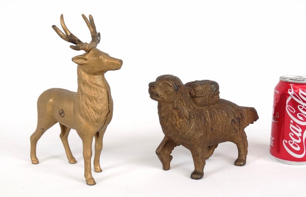 Cast Iron Still Banks: Lot (2) early cast iron still banks including rescue dog (8" L.), and elk (6" L., 9" Ht.).
