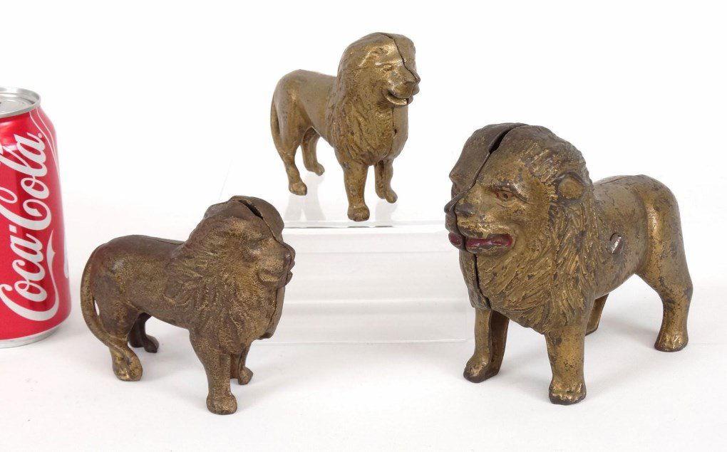 Cast Iron Still Banks: Lot (3) early cast iron lion still banks. 4" to 6" L..