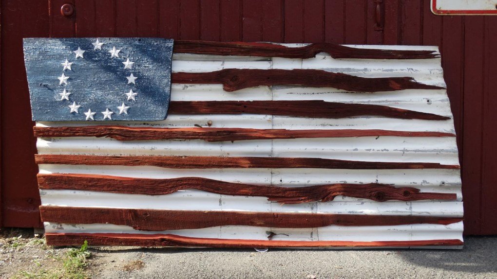 Sheet Metal And Wood Flag Decoration: Sheet metal and wood flag decoration. 37" x 72".