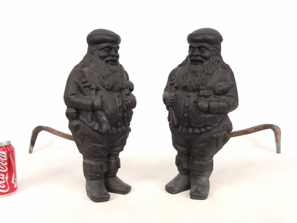 Santa Claus Andirons: Pair of cast iron Santa Claus andirons. 15" Ht., 20" D..