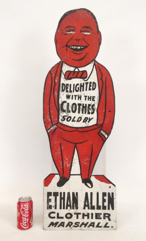 Trade Sign: Early sheet metal trade sign "DLEIGHTED WITH THE CLOTHES SOLD BY ETHAN ALLEN CLOTHIER MARSHALL". 35 1/2" x 12". Property of a Long Island Collector.