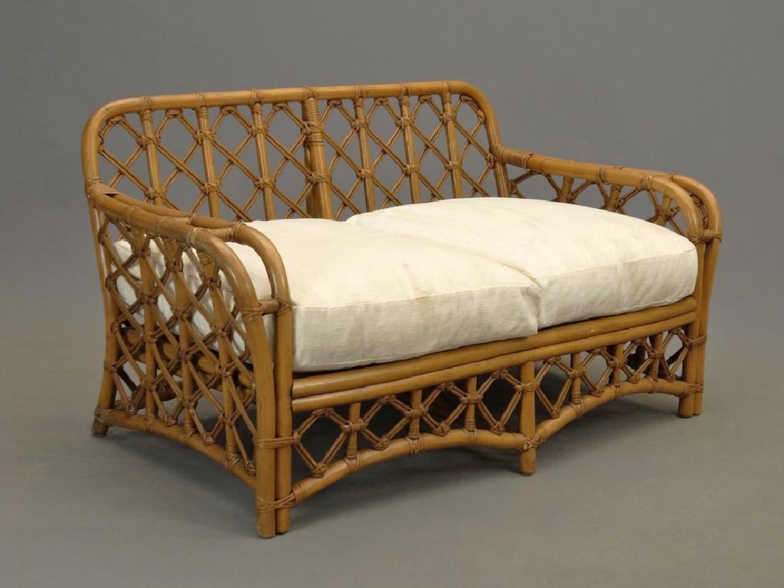 Bamboo Settee: Bamboo settee cushions. Labeled "Fick's Reed". 57" x 30" x 29" Ht..