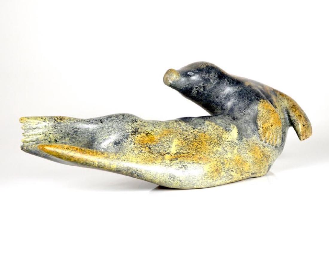 NALENIK TEMELA (1939 - ): Seal. Grey soapstone. Signed in syllabics on base. Dated 1980. Kimmirut, Lake Harbour.H 6 in. x W 17 in. x D 4 in. (15.2 cm. x 43.2 cm. x 10.2 cm.) Alternative Names: Temela Temela, Nalenik Temela, Na