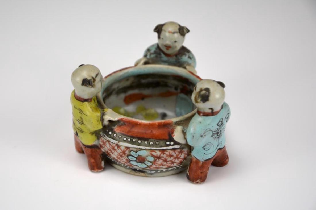 CHINESE FAMILLE ROSE PORCELAIN BRUSHWASH: With three boy figures circulating the washer body. H. 5.7cm (2 1/4 in.)
