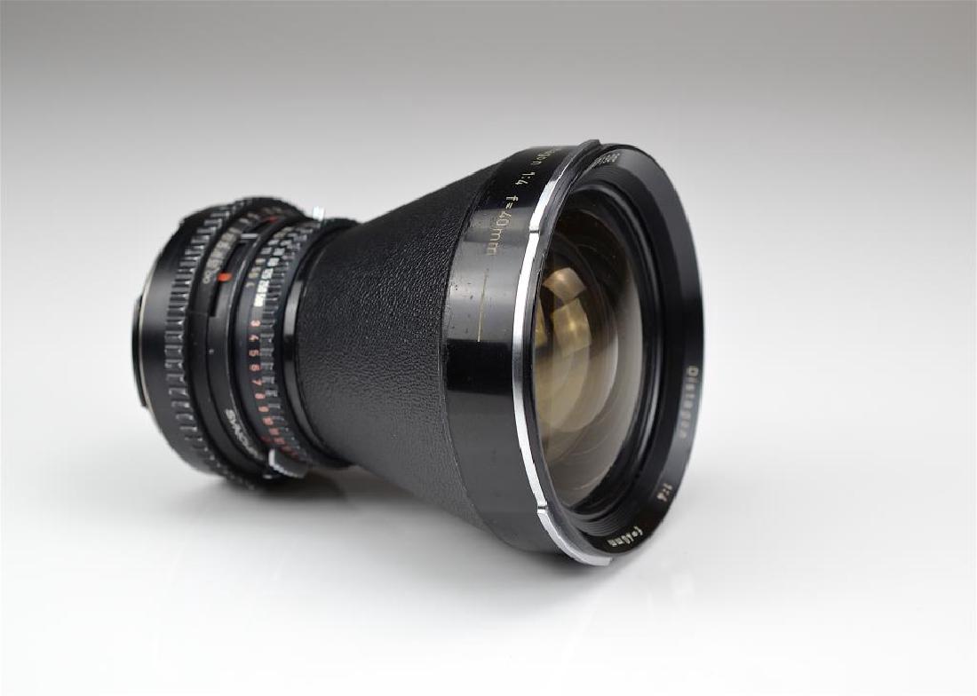 Carl Zeiss 40mm Distagon f=1:4 Ultra Wide Lens: Angle CF Lens Serial No. 4871906 This model provides a rectilinear view with very low distortion and higher resolution. With series filters and filter holders. Good optics, excellent ++ condition.