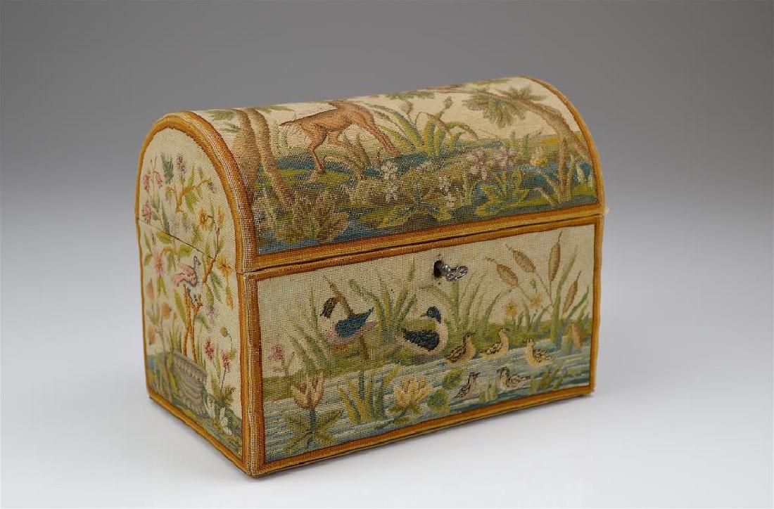 Domed needlepoint casket: Lockable box decorated with nature scenes and animals, lined interior. H 18.4 cm. (7 1/4 in.) W 23.2 cm. (9 1/8 in.)