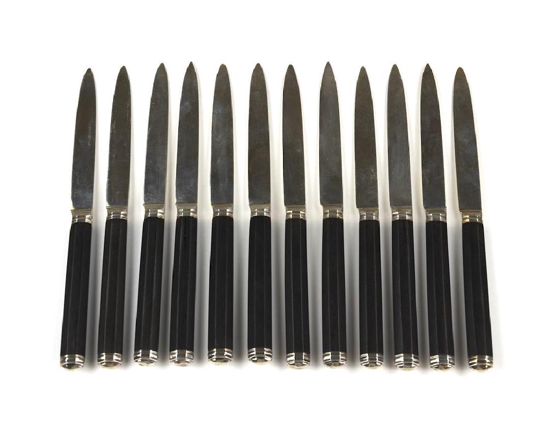 Twelve French silver knives: With ebony handles. Paris, 1777 - 1778. Maker not identified. L 19.7 cm. (7 3/4 in.)