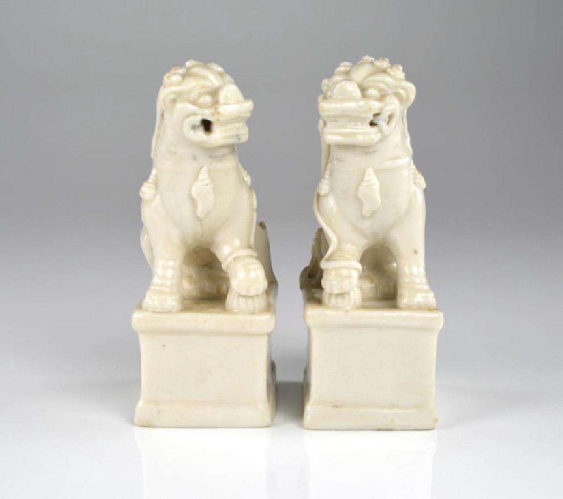 PAIR OF DEHUA PORCELAIN GUARDIAN LION FIGURES (1 of 5)
