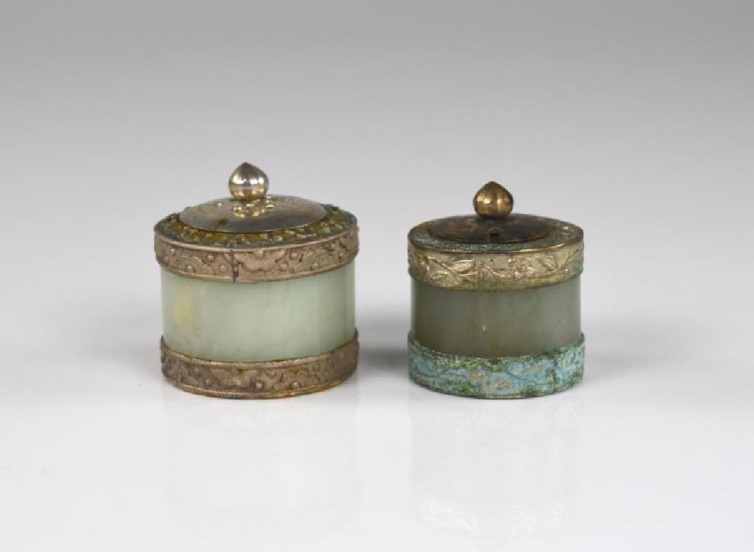 TWO JADE ARCHER RINGS MOUNTED AS SALT CELLARS: Tallest: 3.5cm (1 3/8 in.)