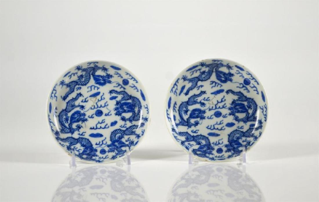 PAIR OF CHINESE BLUE & WHITE PORCELAIN SAUCERS: Painted with five dragons, studio-hall mark Shunli kun Ji to base, Qing dynasty. Incised mark to interior. Dia. 13.1cm (5 1/4 in.)