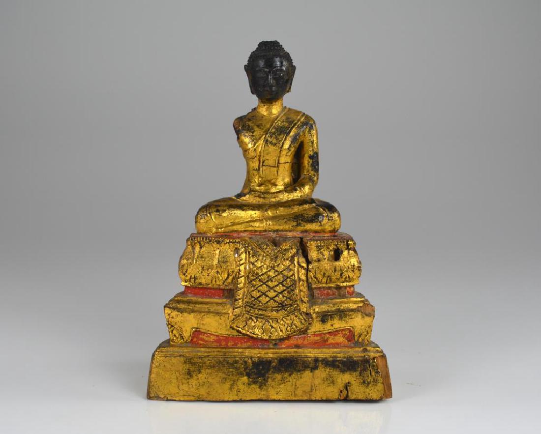 CHINESE GILT WOOD CARVED SEATED BUDDHA: The Buddha meditating on a tiered lotus throne. H. 23.5 cm (9 1/4 in.)
