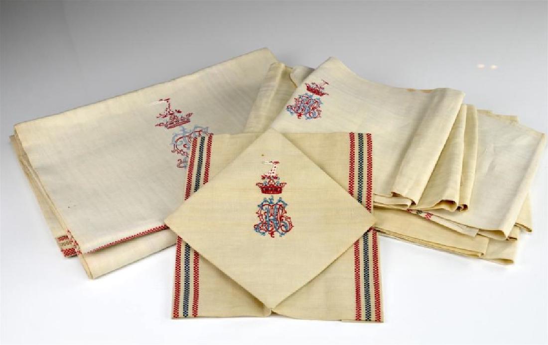 Eleven monogrammed and crested linens: Including ten napkins and one tablecloth. Given as a gift by Russian Princess Tania Obolensky. Acquired through descent.