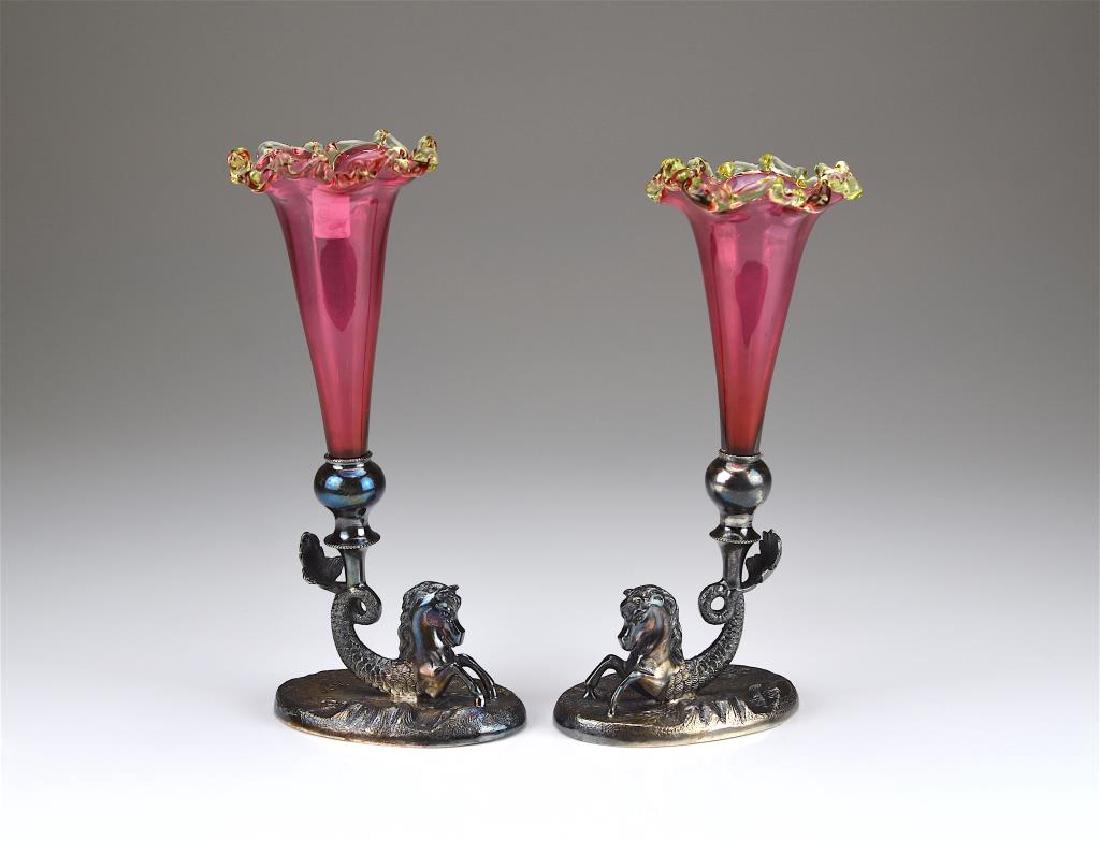 Two silverplated & cranberry glass epergnes: Each of a seahorse with ruffled glass flutes, late 19th C. H 21 cm (8 1/4 in.)