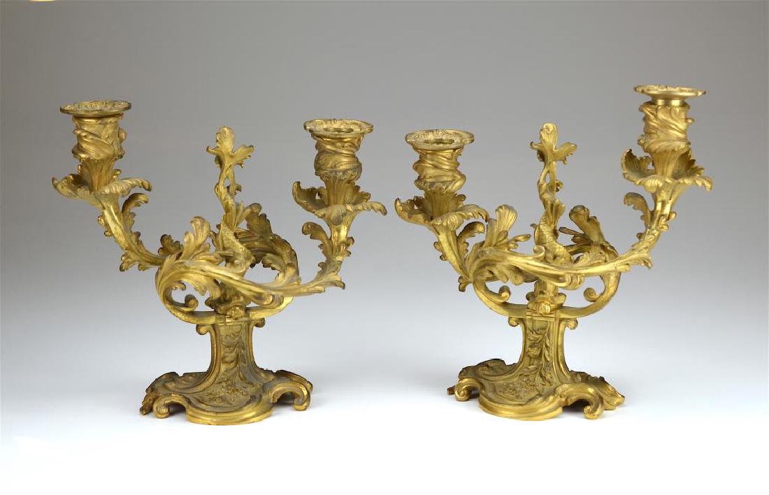 Pair of French bronze candelabra: Rococo style with central dolphin base, late 19th C. H 24 cm (9 1/4 in.)