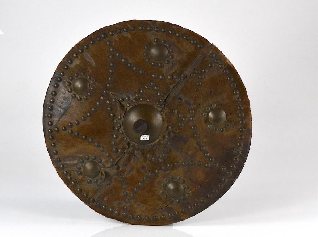 Early hide covered studded shield (1 of 7)