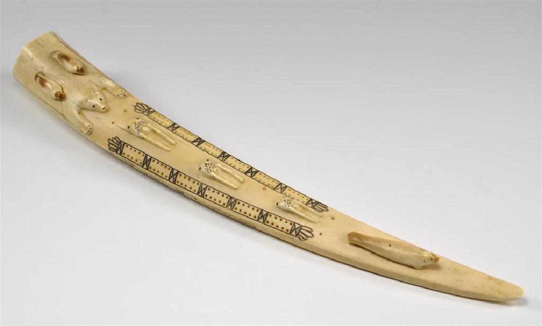Inuit tusk scrimshaw cribbage board