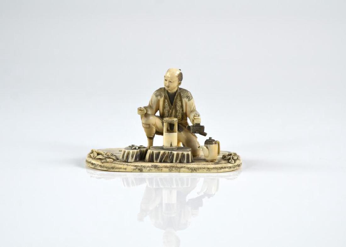 JAPANESE IVORY OKIMONO OF STREET SELLER (1 of 8)