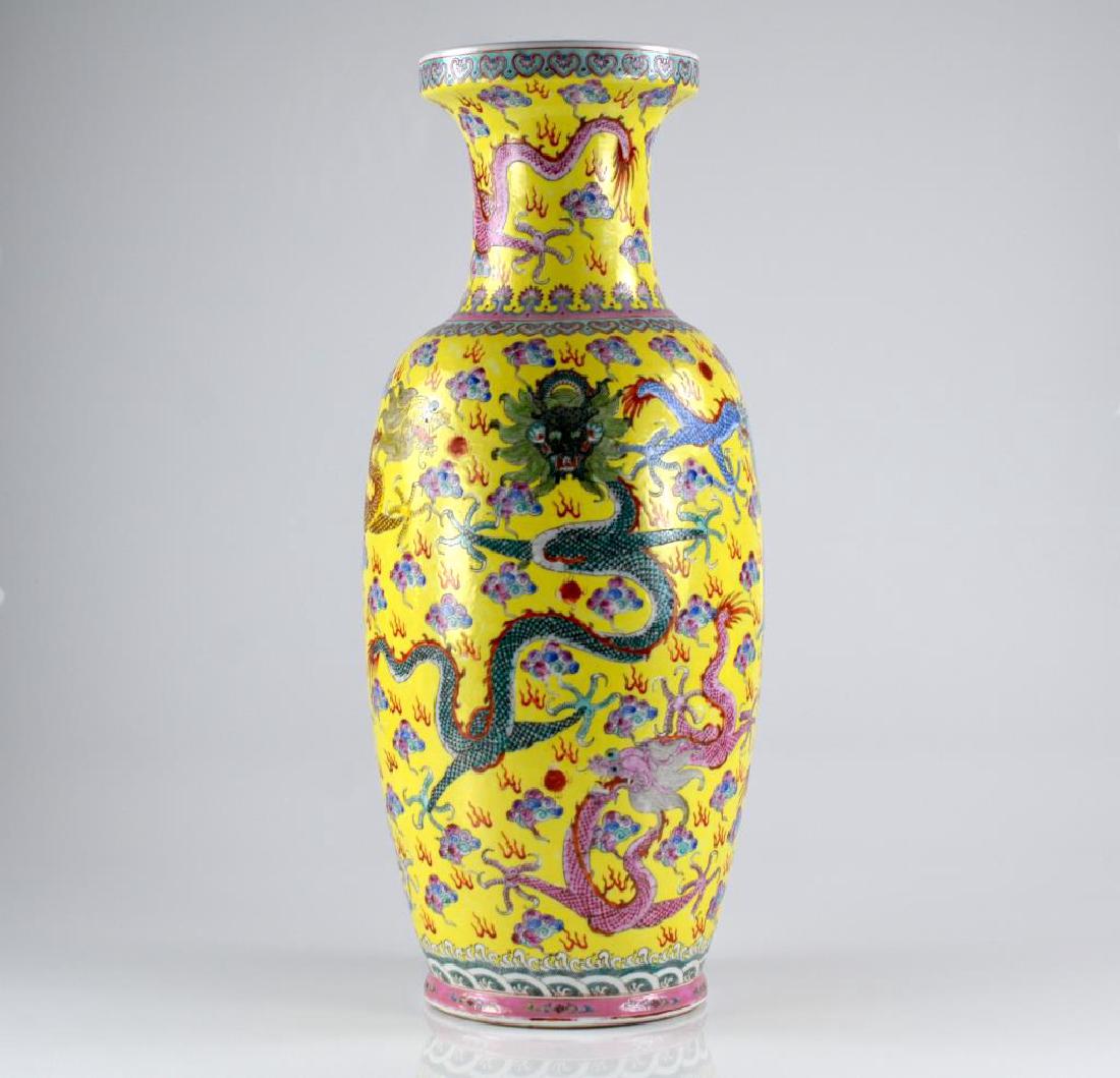 CHINESE FAMILLE JAUNE PORCELAIN VASE: Hand painted with five clawed dragons surrounded by clouds and fireballs, four character mark to base.