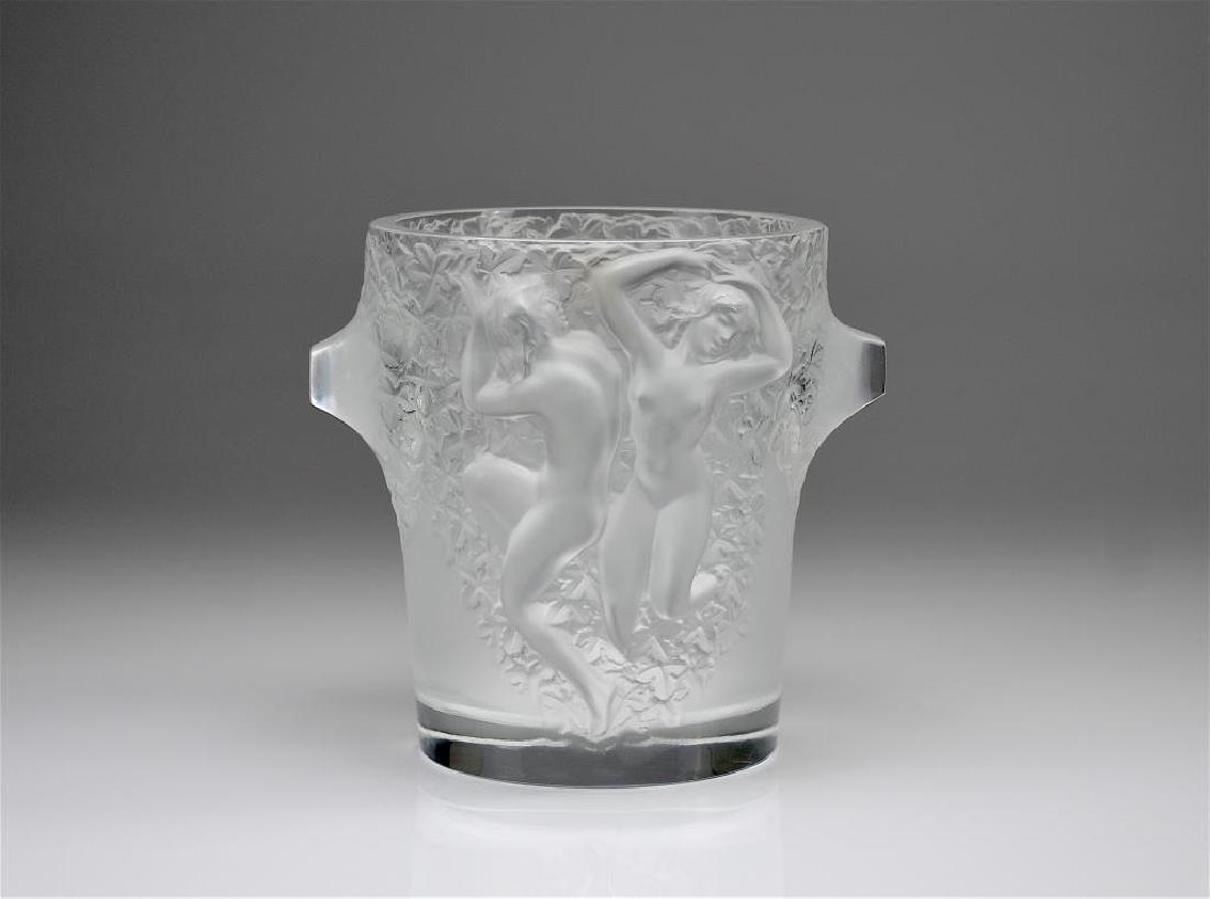 Lalique Ganymede wine cooler: Frosted glass champagne bucket decorated with nude female figures on an ground of ivy leaves. Signed Lalique France to base. H. 22.9 cm (9 in.)
