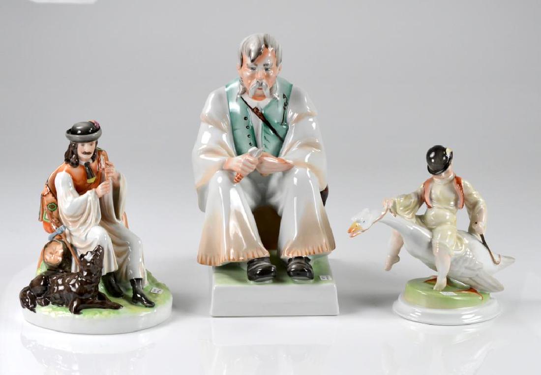 Three Hungarian figurines: Herend boy on goose, and two Zsolnay figures of men
